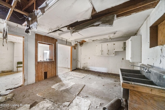 kitchen featuring white cabinets