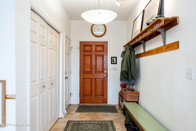 mudroom featuring a textured ceiling