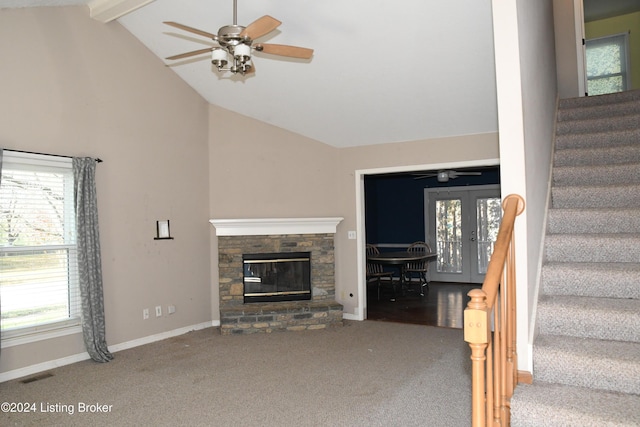 unfurnished living room featuring beam ceiling, carpet floors, high vaulted ceiling, and ceiling fan