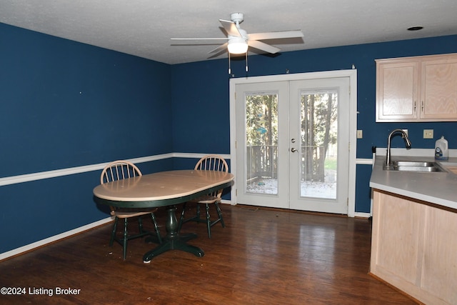 dining area with french doors, a textured ceiling, ceiling fan, sink, and dark hardwood / wood-style floors