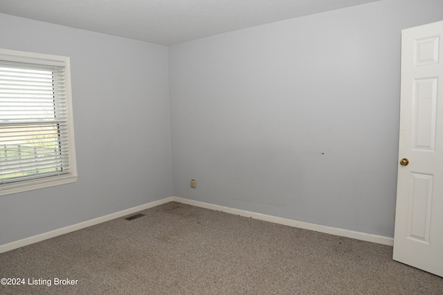 unfurnished room with carpet floors