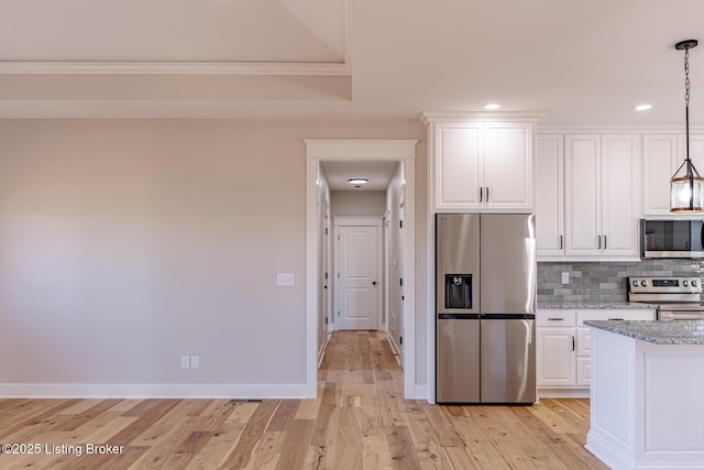 kitchen featuring light stone counters, backsplash, light wood-type flooring, and appliances with stainless steel finishes