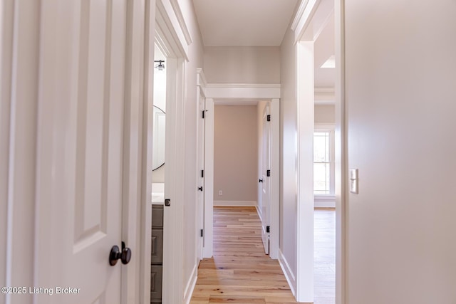 corridor featuring light wood-style flooring