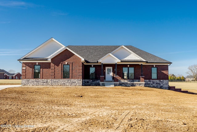 view of front of home featuring brick siding