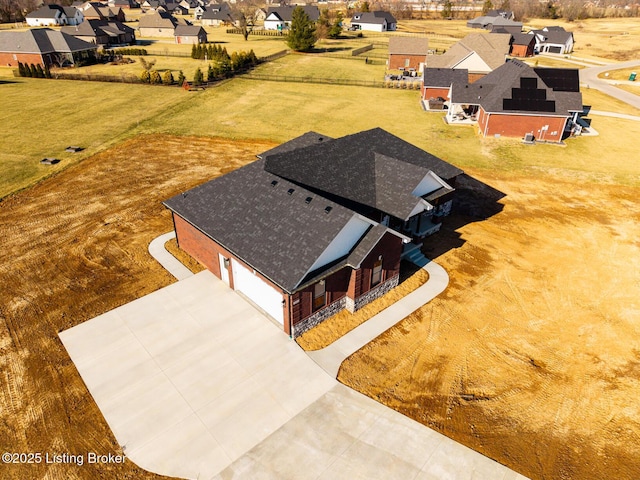 birds eye view of property with a residential view