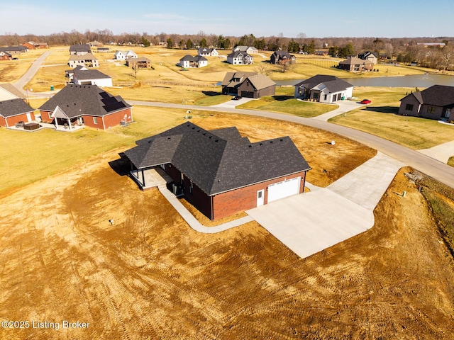 birds eye view of property with a residential view