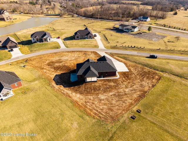 drone / aerial view featuring a water view