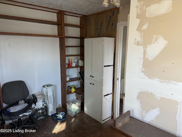 miscellaneous room featuring a textured ceiling