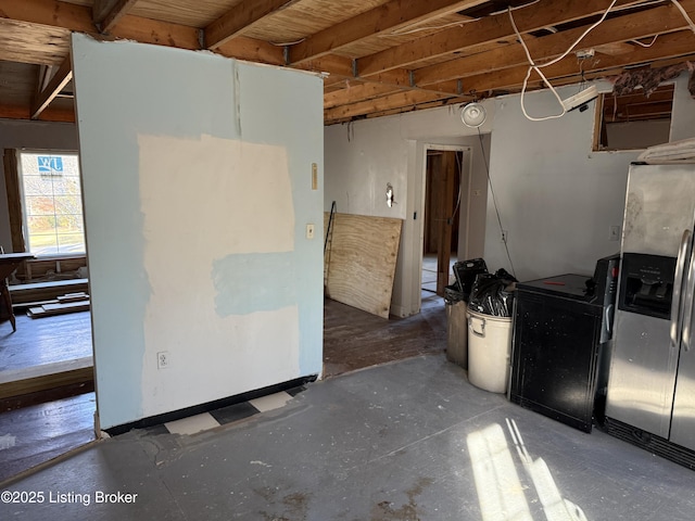 kitchen featuring stainless steel fridge with ice dispenser