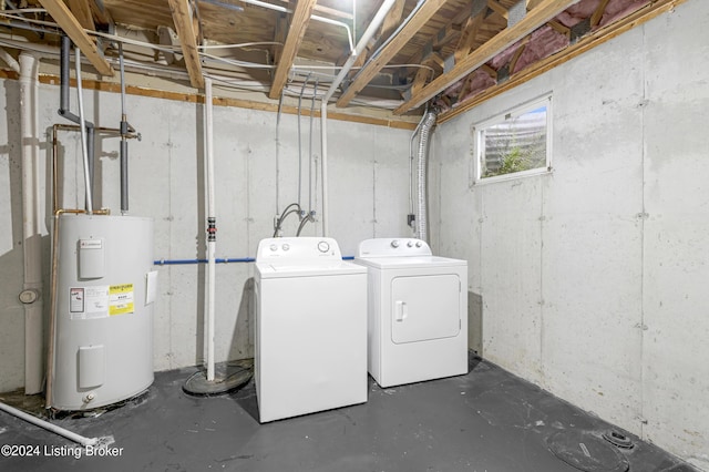 laundry room with washer and clothes dryer and water heater