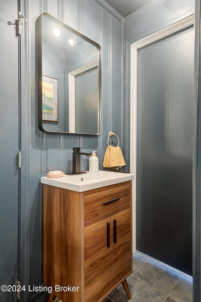 bathroom with tile patterned flooring and vanity