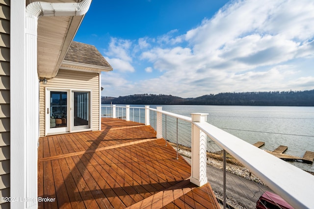 wooden deck with a water view