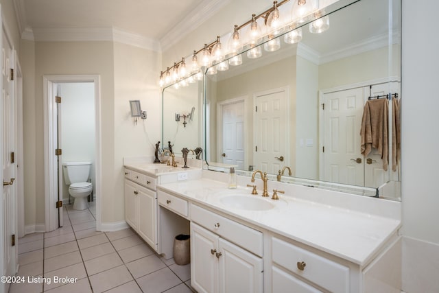 bathroom with tile patterned flooring, vanity, toilet, and crown molding