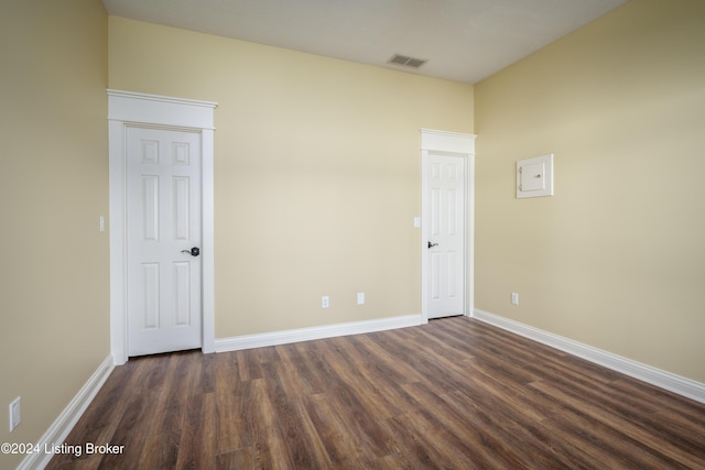 spare room featuring dark hardwood / wood-style flooring