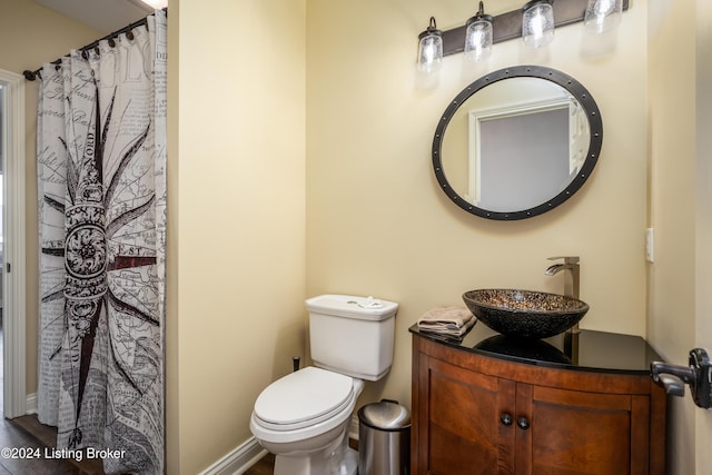 bathroom featuring vanity and toilet