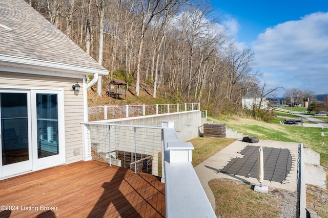 wooden terrace featuring a patio area