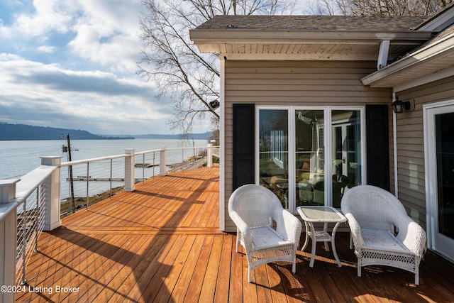 wooden terrace with a water view