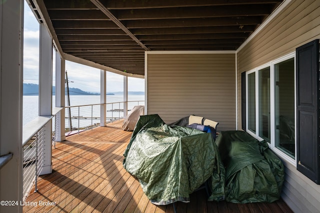 deck featuring a water view