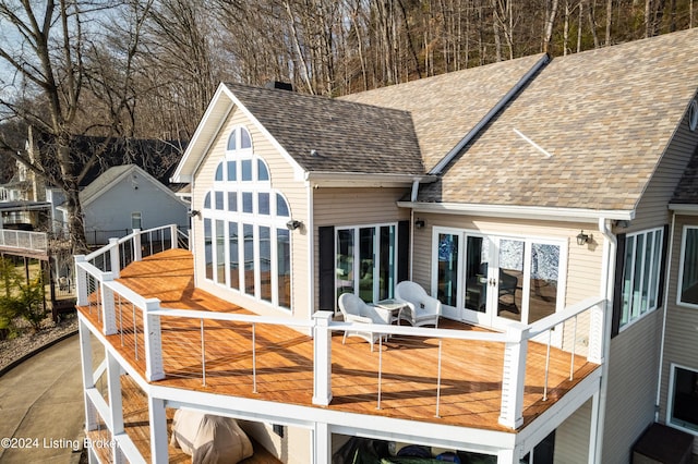 back of property featuring a balcony