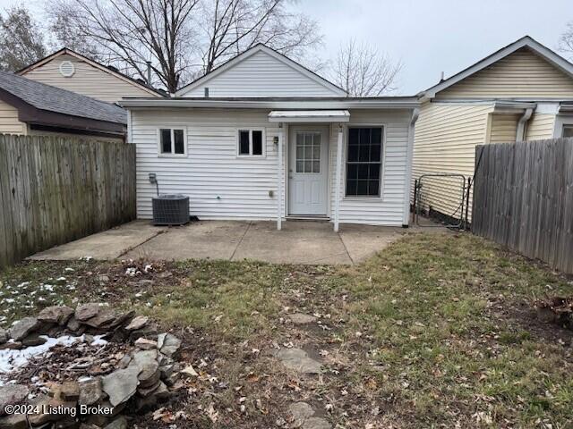 back of house with a patio and cooling unit