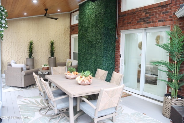 view of patio with ceiling fan and a deck