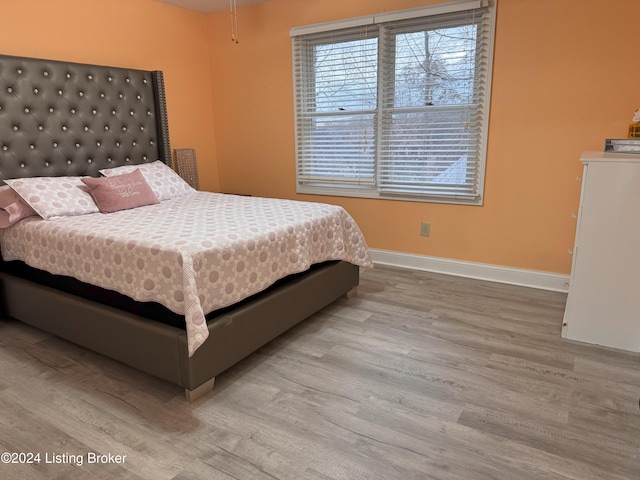 bedroom with light wood-type flooring