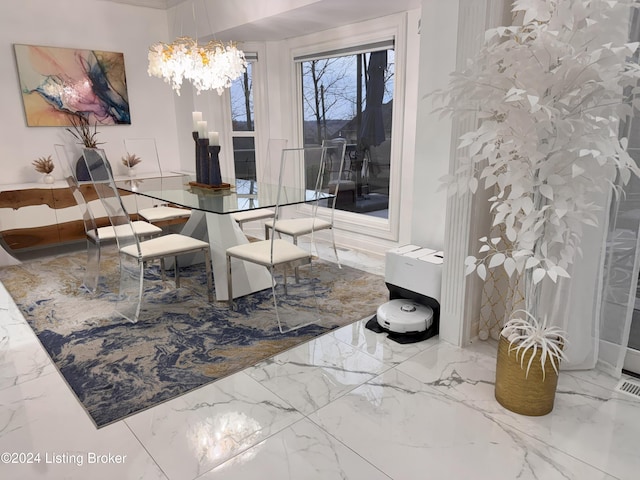 dining area featuring an inviting chandelier