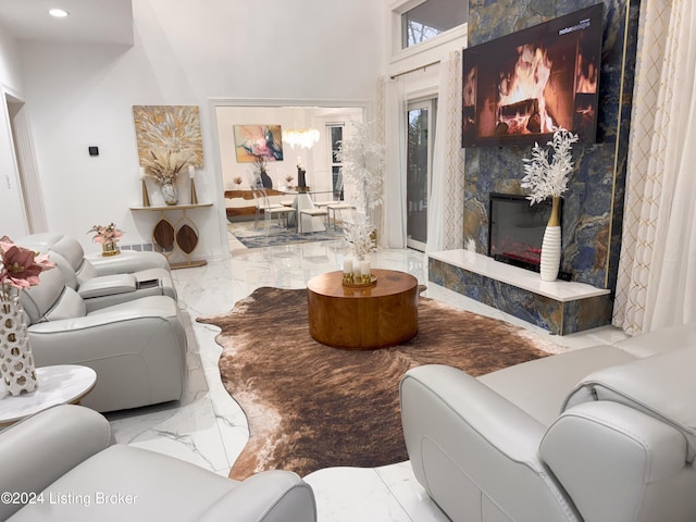 living room with a high end fireplace