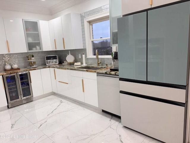 kitchen with dishwasher, white cabinets, sink, wine cooler, and decorative backsplash