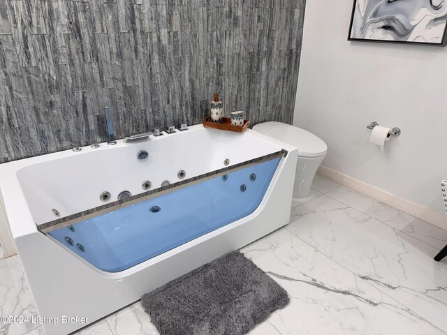 bathroom with a bathing tub and toilet