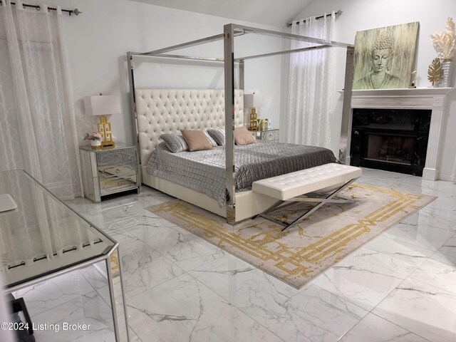 bedroom featuring lofted ceiling