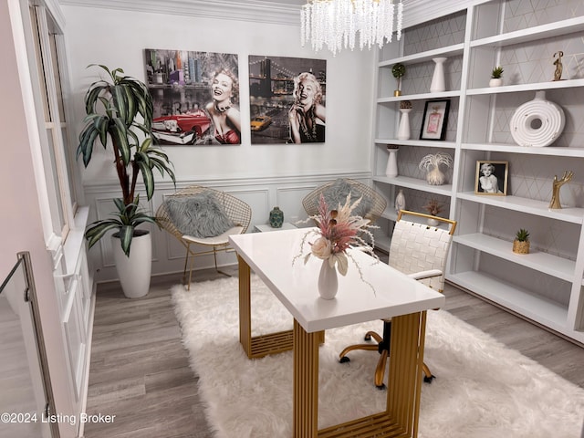 office with crown molding, hardwood / wood-style floors, and a notable chandelier