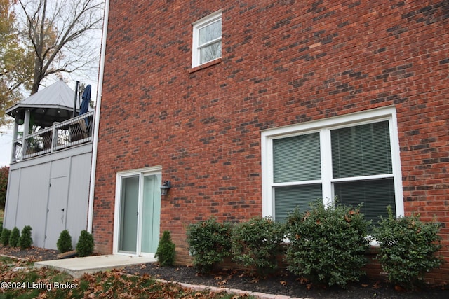 view of side of property featuring a balcony