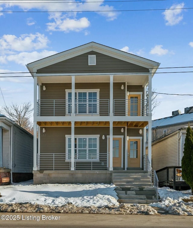 view of front facade featuring a porch and a balcony