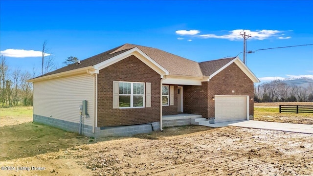 ranch-style house featuring a garage