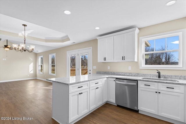 kitchen with white cabinets, sink, stainless steel dishwasher, dark hardwood / wood-style floors, and light stone countertops