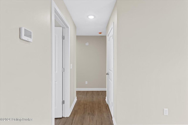 corridor featuring hardwood / wood-style flooring