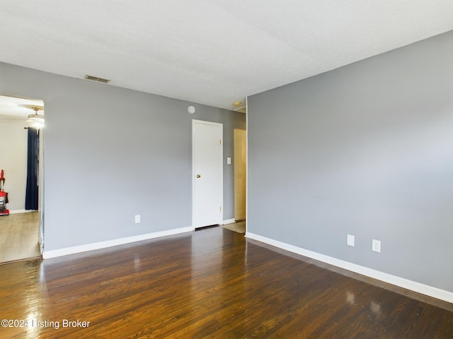 empty room featuring dark hardwood / wood-style floors