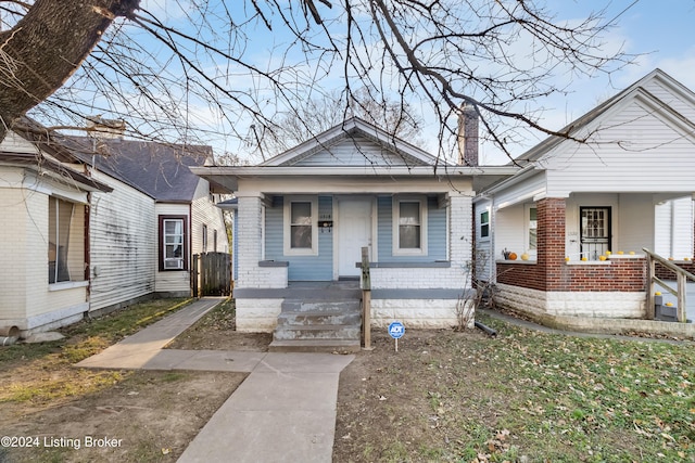 bungalow-style home with a porch