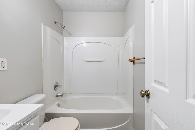 full bathroom with vanity, toilet, shower / bath combination, and a textured ceiling