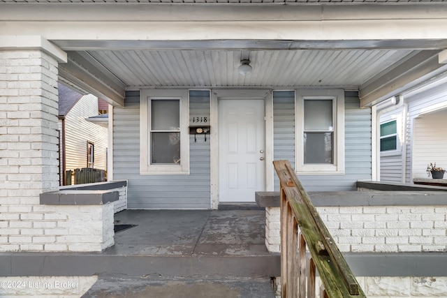 property entrance featuring covered porch