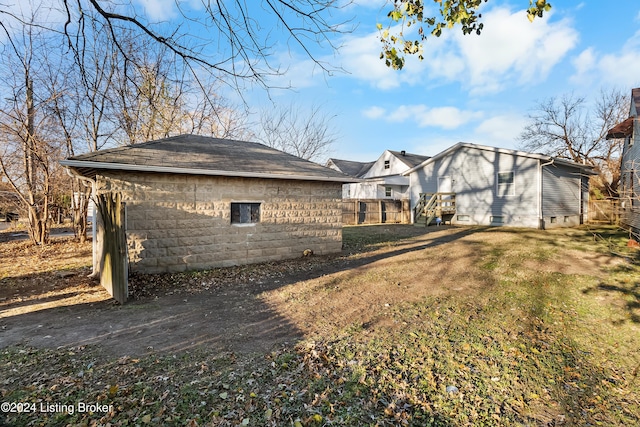 rear view of property with a yard