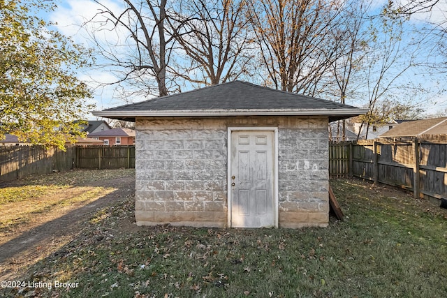 view of outbuilding with a yard