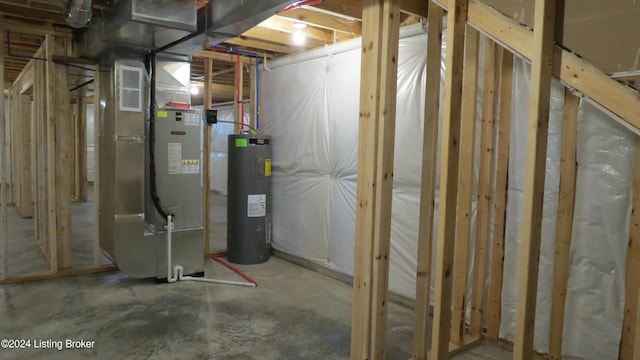 utility room with heating unit and electric water heater