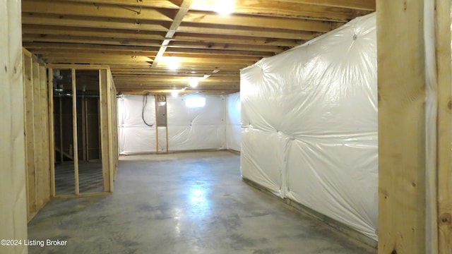 basement featuring electric panel