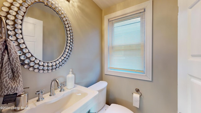 bathroom with toilet and sink