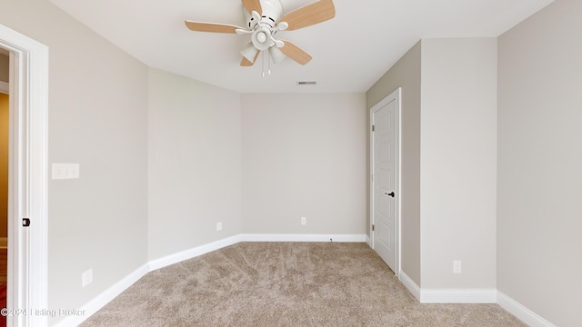 carpeted empty room with ceiling fan