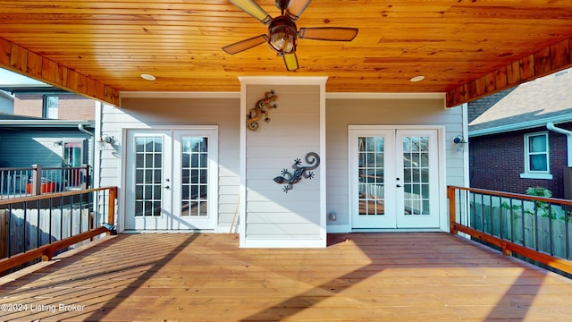 wooden terrace featuring french doors and ceiling fan