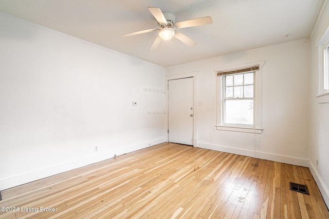 spare room featuring ceiling fan, light hardwood / wood-style flooring, and ornamental molding