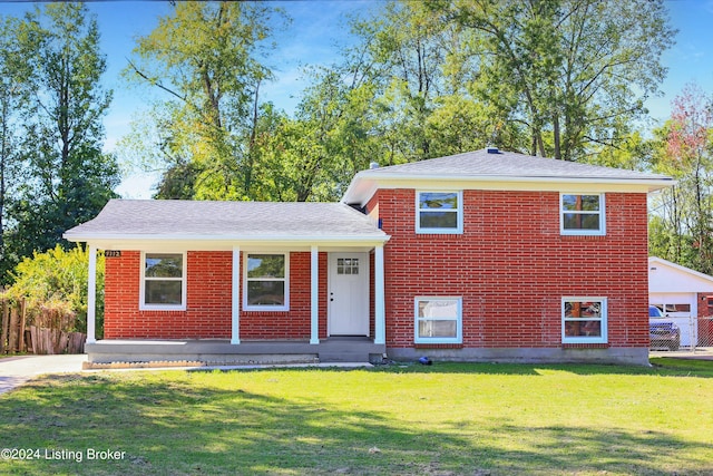 tri-level home with a front yard